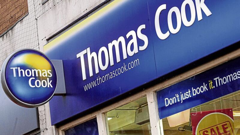 Thomas Cook has warned over a hit to annual earnings as the UK and European heatwave dented demand for last-minute trips abroad 