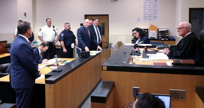 Suffolk County district attorney Ray Tierney, left, inside Judge Timothy Mazzei’s courtroom at Suffolk County Court in Riverhead on Tuesday, when alleged Gilgo Beach Killer Rex Heuermann was indicted in the death of Maureen Brainard-Barnes (Newsday via AP)