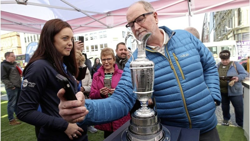 Members of the public got a glimpse of the Claret Jug at Belfast City Hall yesterday. Picture by Hugh Russell 