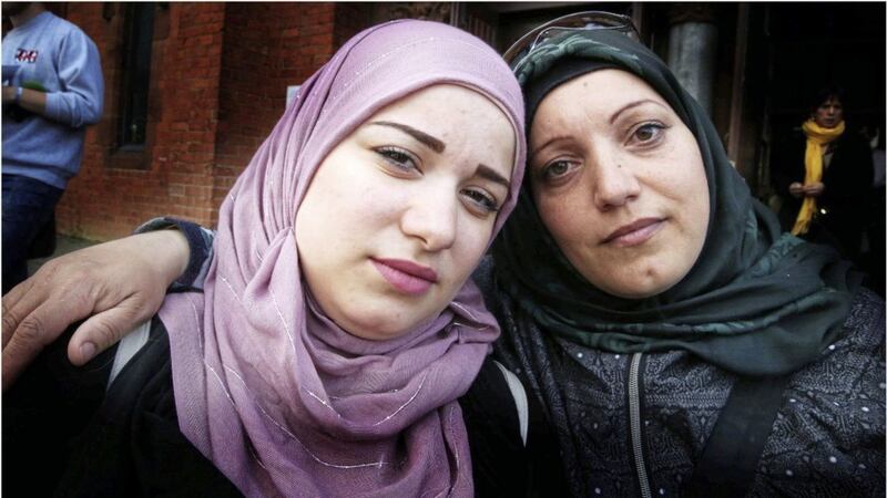 Raneem Mando (left) and Kamar Homs spoke out about housing conditions experienced by Syrian refugees in west Belfast. Picture by Hugh Russell 
