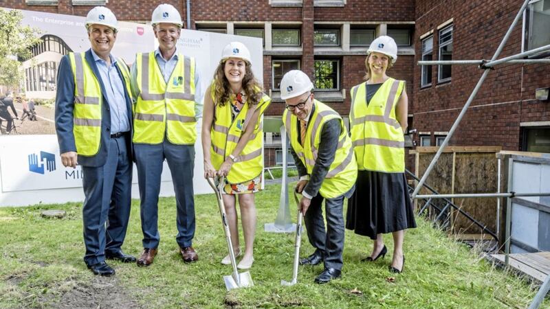 Henry Brothers Midlands managing director Ian Taylor joins the sod-cutting part at NTU 