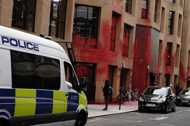 Police outside the Labour Party headquarters after the paint attack by Youth Demand activisits