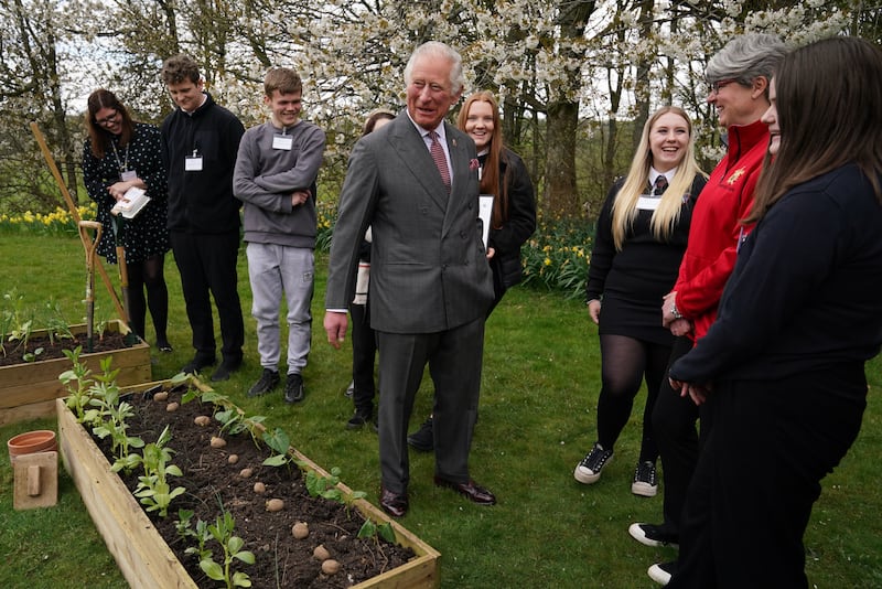 Charles meeting children from Robert Burns Academy, winners of the food waste solution challenge, as part of the Food For The Future education programme
