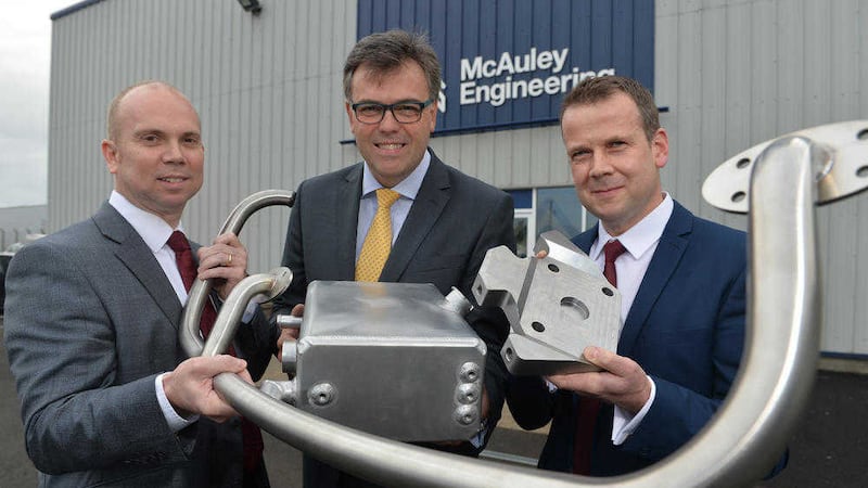 From left, during a visit to McAuley&rsquo;s premises are Jonathan McAuley, Invest NI CEO Alastair Hamilton and David Condell, McAuley's general manager