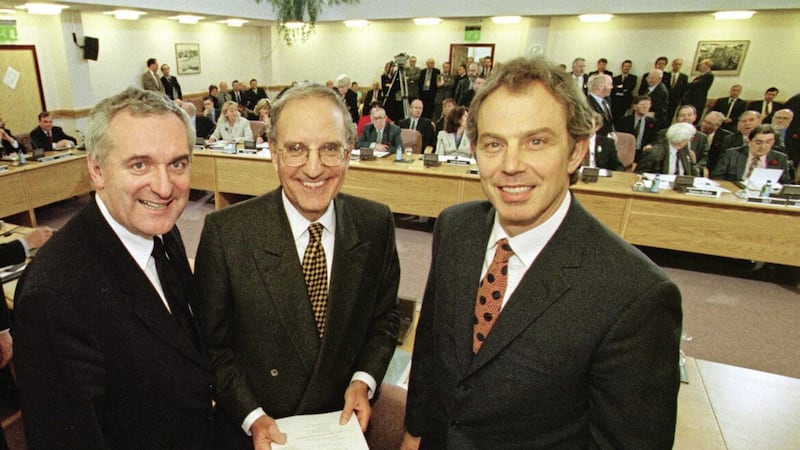 Former Prime Minister Tony Blair (right), former US Senator George Mitchell (centre) and former Taoiseach Bertie Ahern after signing the Good Friday Agreement in April 1998 