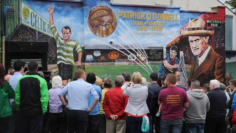 Crowds gather as a new mural is unveiled in Belfast in August to mark the life of footballer Patrick O&#39;Connell. Picture by Hugh Russell 
