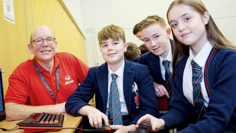 Head of Computer Science and ICT at Wellington College Belfast Gareth O&rsquo;Hare with Year 10 pupils Matthew McKenna, Darragh Kelly and Nicole Krauze 