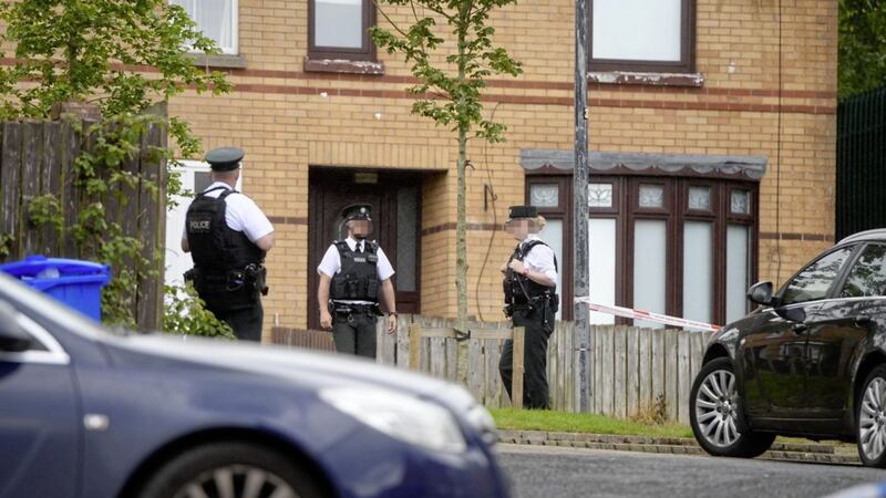 PSNI officers at the scene in Poleglass where two people were found dead. Picture by Mark Marlow. 