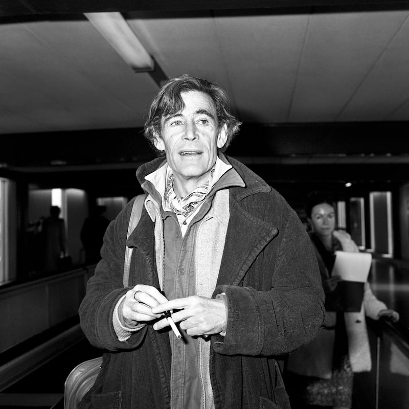 Actor Peter O'Toole leaving Heathrow Airport for Los Angeles on a business trip. He was wearing a blue woollen dressing gown as an overcoat.