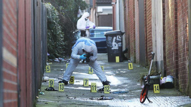 Forensic teams yesterday at the rear of homes at My Lady&#39;s Road in east Belfast. Picture by Hugh Russell 