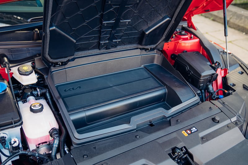 The Kia EV6's front luggage compartment is an ideal place to store the car's charging cable