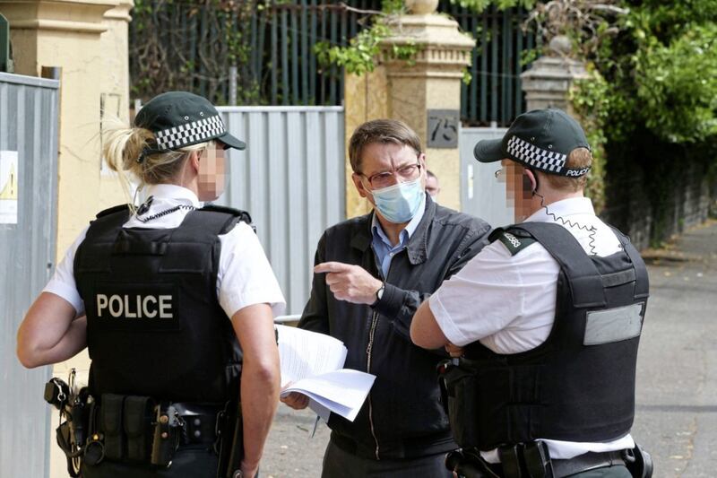 Police speak to residents protesting outside the Chinese Consulate on Malone Road in south Belfast. Picture by Mal McCann 
