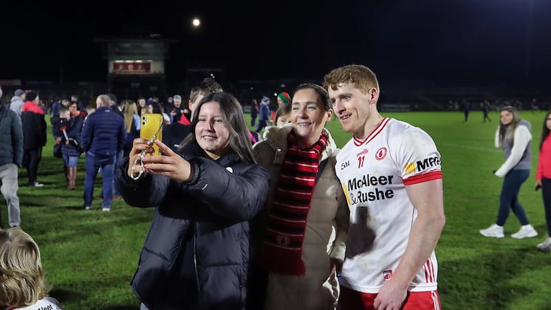 Supporters on the pitch for pictures and autographs wity players including Peter Harte, after watching Tyrone beat Mayo during the National League Division 1 match played at Healy Park in Omagh on Saturday 24th February 2024. Picture Margaret McLaughlin