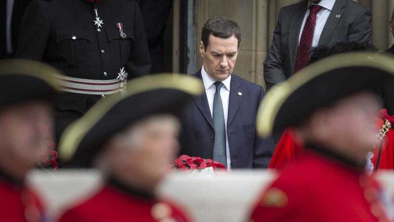 Chancellor George Osborne prepares to lay a wealth at the Cenotaph in St Peter&#39;s Square, Manchester yesterday PICTURE: Danny Lawson/PA 