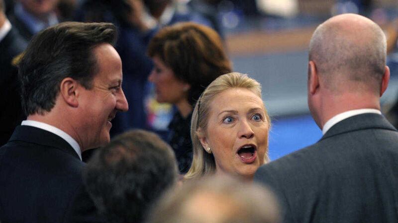 An aide to Hillary Clinton, pictured with David Cameron, accused the prime minister of &quot;threatening recklessly&quot; the success of the north&#39;s political talks in 2010. Picture by AP Photo/Philippe Wojazer Pool 