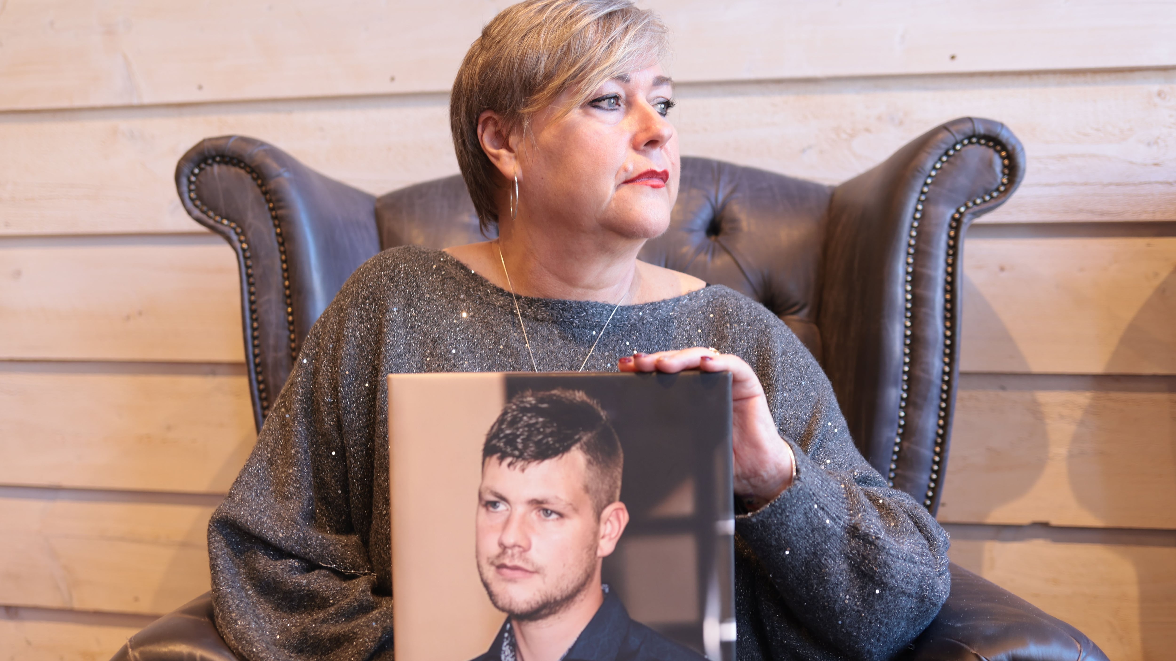 Gillian McCann holds a portrait of her late son Jay Woolsey who died from an accidental overdose in 2024. PICTURE:BRIAN LINCOLN
