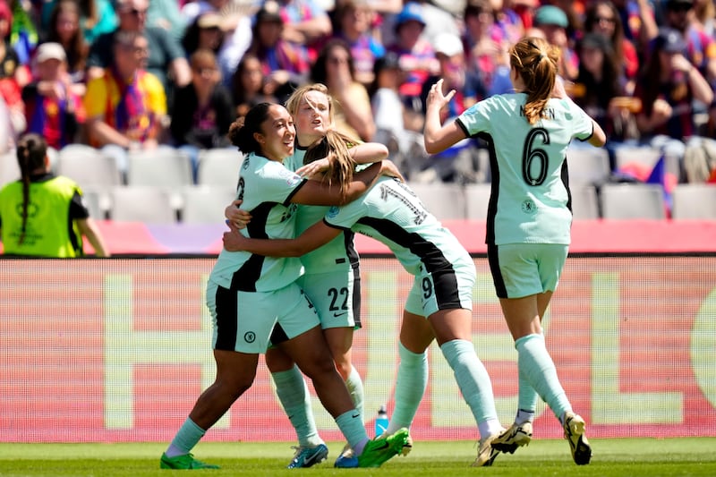 Chelsea’s Erin Cuthbert, (second left) celebrates with her team-mates after scoring at Barcelona