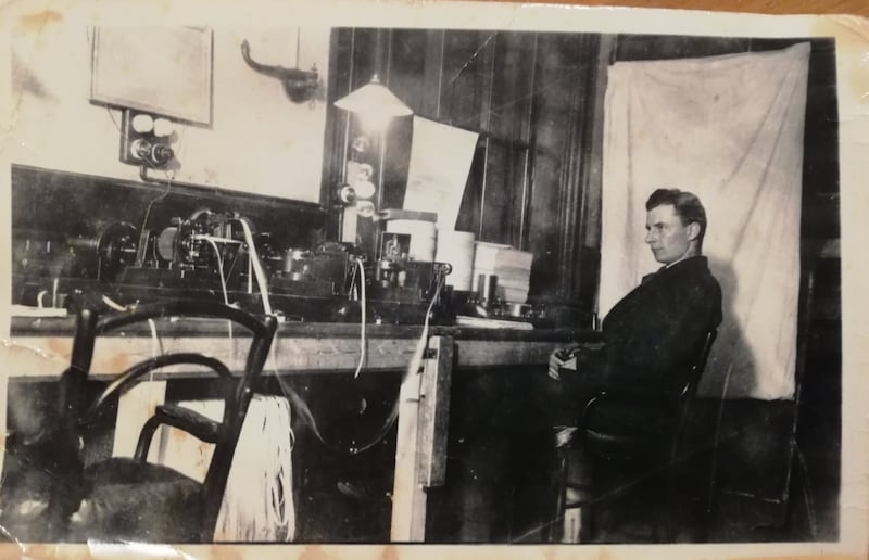 Tim O'Connor working at his morse telegraph machine 