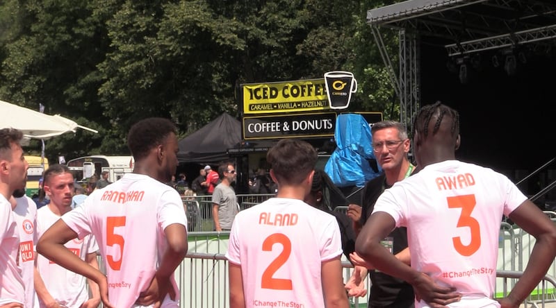 Craig McManus, manager of the England men's team at the 2019 Homeless World Cup, talks to his players