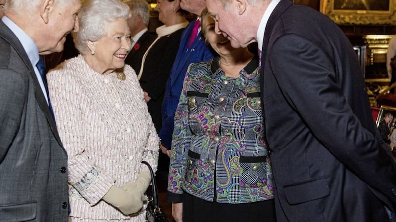 Martin McGuinness meeting Queen Elizabeth at an event in Crosby Hall, London in November 2016. Also pictured is Dr Christopher Moran, chairman of Co-operation Ireland. Photo: Jeff Spicer/PA 