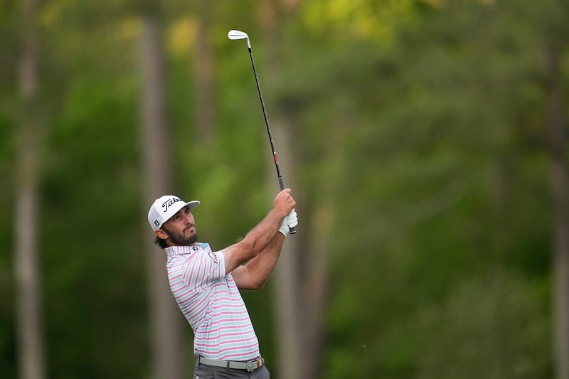 Max Homa watches his tee shot on the 12th hole during the first round of the 88th Masters (George Walker IV/AP)