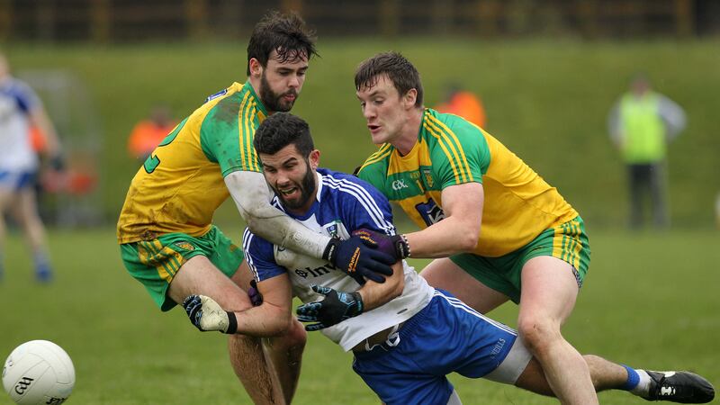 Monaghan's Neil McAdam is tackled by Donegal's Leo McLoone and Odrhran Mac Naiallais during Sunday's National League game<br/>Picture by Philip Walsh&nbsp;
