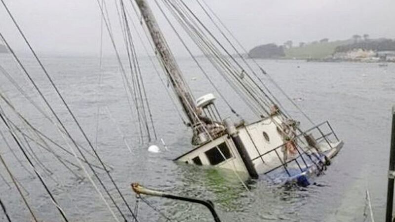 A boat began sinking in Portaferry harbour with around 1,000 litres of diesel onboard. Picture from BBC 