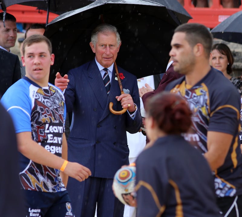 Charles watching rugby players training on Bondi Beach in 2012