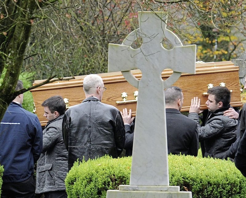 Pall-bearers carrying the coffin of Patrick Ignatius (Nishi) Ward from the Sacred Heart Church, Plumbridge, to the adjoining burial plot in November 