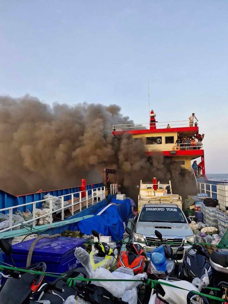 Smoke rising from the ferry in Surat Thani province, Thailand (Maitree Promjampa via AP)