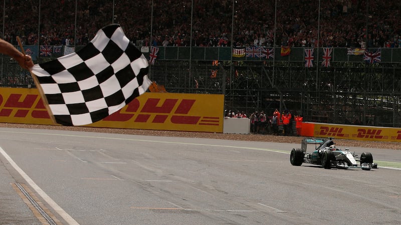 Mercedes' Lewis Hamilton crosses the line to win the 2015 British Grand Prix at Silverstone<br />Picture: PA