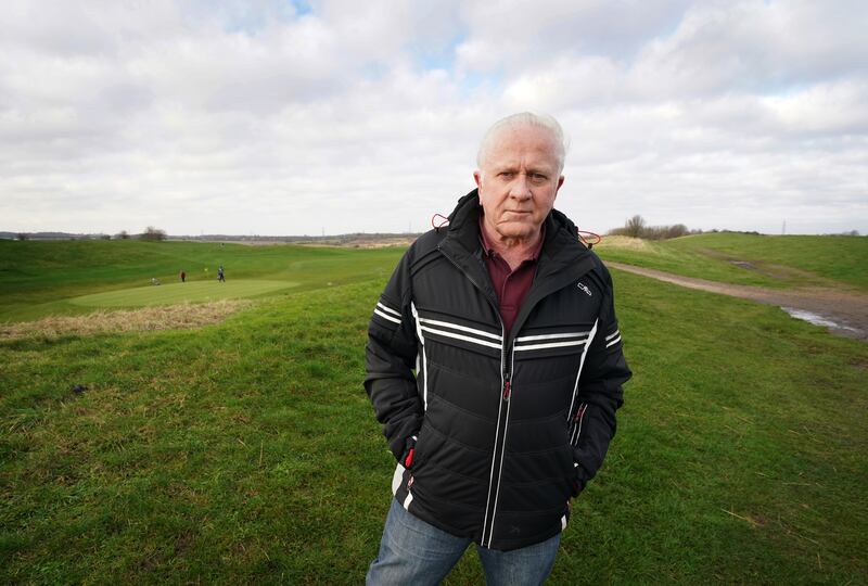 Parish councillor Vince Robson stands at the site of a proposed garden city development at Pedham Place Golf Course