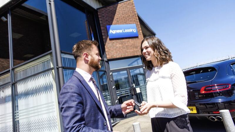 Agnew Leasing account manager Josh Kernohan takes a customer through the leasing process 