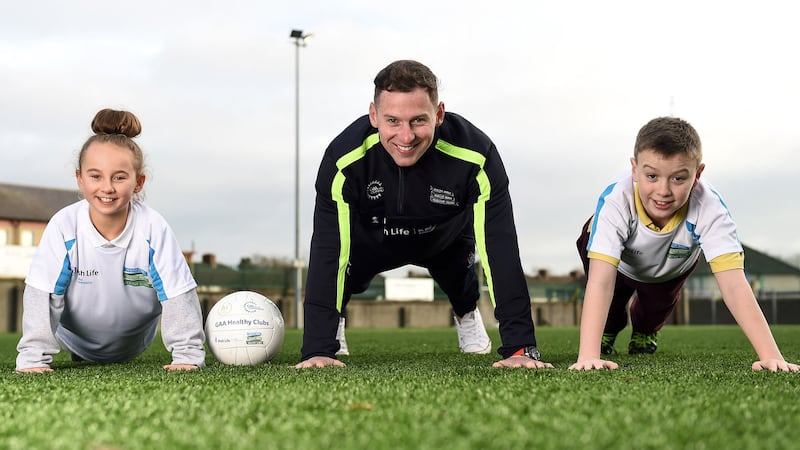 Dublin footballer Philly McMahon with Nicole Cleary (11) from St Brigid&rsquo;s GNS and Sean McHugh (11) from Scoil Chiarain CBS, at the GAA Healthy Clubs launch at Craobh Chiarain GAA Club, Parnell Park in Dublin yesterday <br /> Picture by Sportsfile&nbsp;
