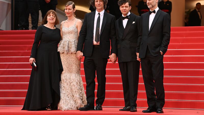 Ewa Puszczynska, Sandra Huller, Jonathan Glazer, Christian Friedel, and James Wilson, attending the Zone of Interest premiere during the 76th Cannes Film Festival