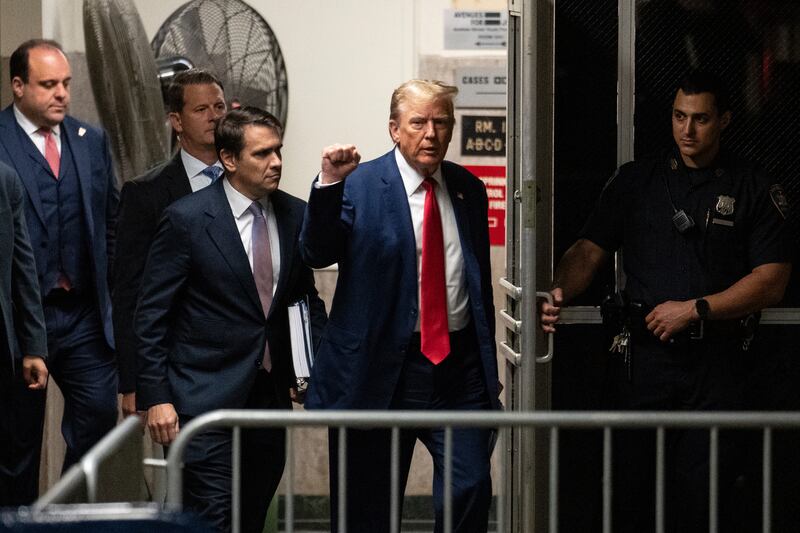 Former US president Donald Trump returns from a break at Manhattan Criminal Court in New York (Jeenah Moon/Pool Photo via AP)