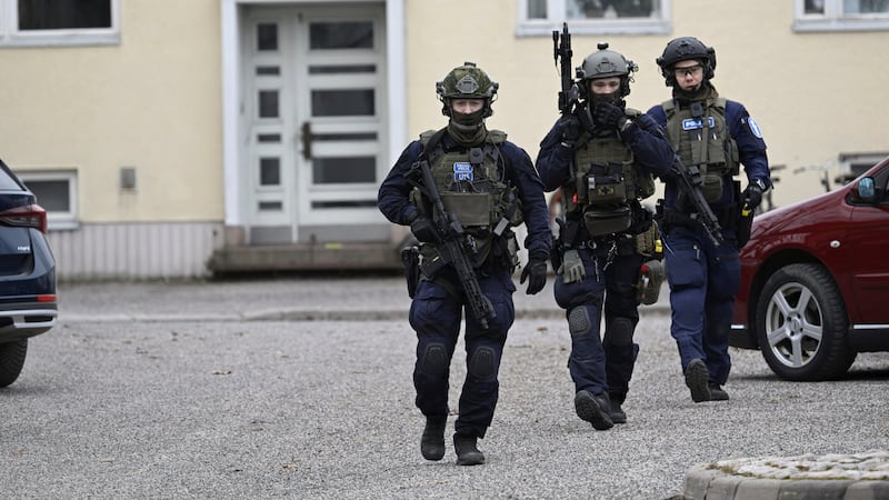 Police officers at the scene of Viertola comprehensive school, in Vantaa, Finland where three were wounded in a shooting (Markku Ulander/Lehtikuva via AP)