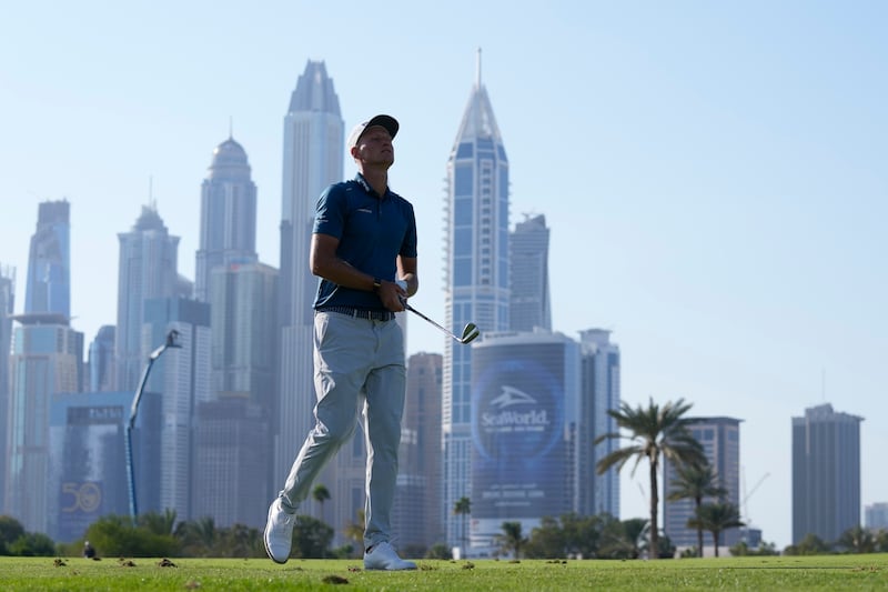 Adrian Meronk follows his ball on the 13th hole during the second round of the Hero Dubai Desert Classic (Kamran Jebreili/AP)