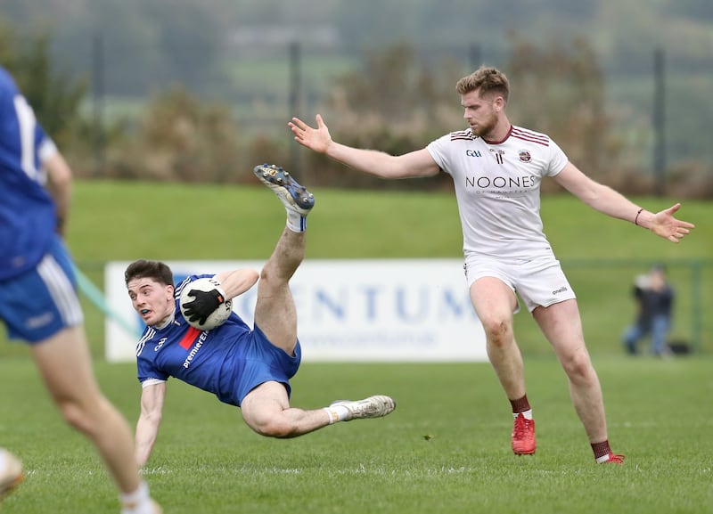 Slaughtneil's Jerome McGuigan with Conleth McShane of Bellaghy Picture: Margaret McLaughlin