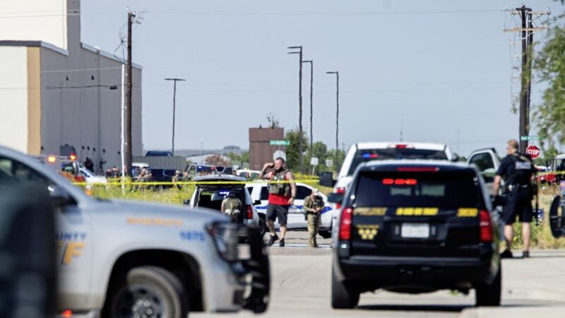 Odessa and Midland police and sheriff&#39;s deputies surround the area behind Cinergy in Odessa, Texas, Saturday. Picture: Tim Fischer/Midland Daily News via AP 
