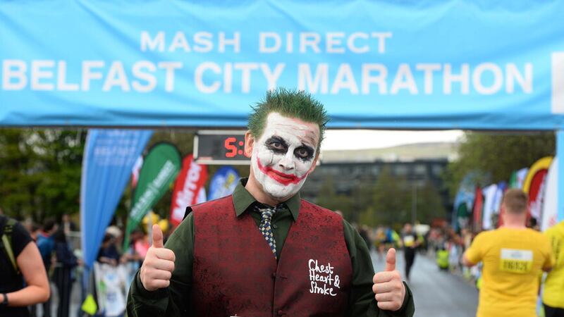 Alex McCullough celebrates at the finish line of the Belfast City Marathon. Picture by Mark Marlow