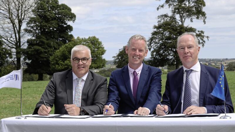 Devenish Group chief executive Richard Kennedy (left) with Andrew McDowell (vice-president of the European Investment Bank) and Owen Brennan (chairman of Devenish) 