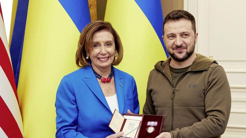 Ukrainian President Volodymyr Zelenskyy, right, awards the Order of Princess Olga, the third grade, to US Speaker of the House Nancy Pelosi in Kyiv, Ukraine on Saturday April 30. Pelosi, second in line to the presidency after the vice president, is the highest-ranking American leader to visit Ukraine since the start of the war, and her visit marks a major show of continuing support for the country&#39;s struggle against Russia PICTURE: Ukrainian Presidential Press Office/AP 