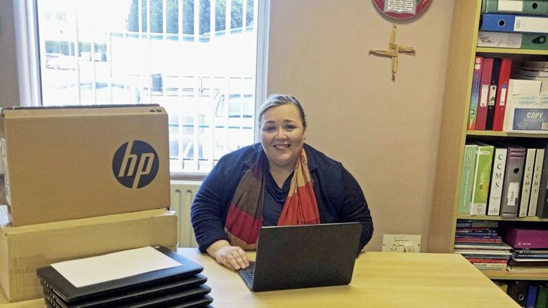 St Ronan&rsquo;s College principal Fiona Kane with some of the laptops at the school provided with the help of Cancom, sportswear manufacturer O&rsquo;Neill&rsquo;s, McKeagney Pharmacy, and Hannon Transport 