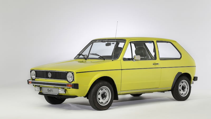 A photo of a yellow Mk1 Volkswagen Golf in mint condition