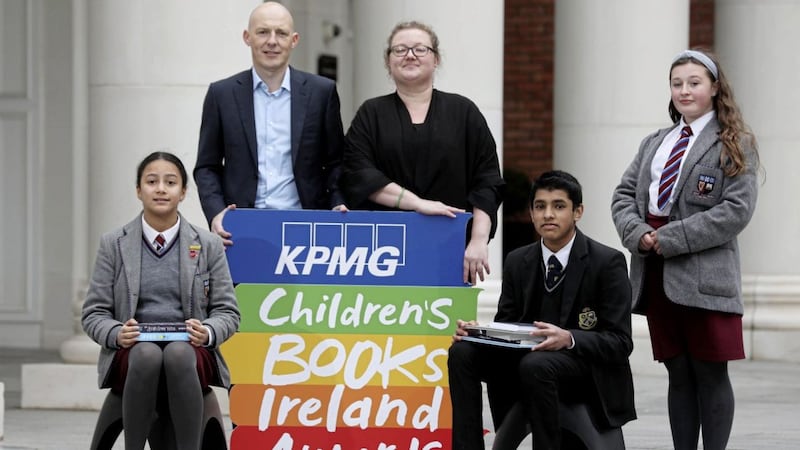 Young readers along with Johnny Hanna of KPMG Northern Ireland and Jenny Murray from Children&rsquo;s Books Ireland attend the shortlist announcement for the KPMG Children&#39;s Books Ireland Awards in Belfast 