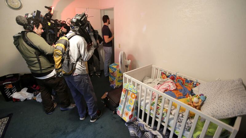 Members of the media crowd into a child's room in an apartment in Redlands, California, shared by San Bernardino shooting rampage suspects Syed Farook and his wife, Tashfeen Mali. Picture by Chris Carlson, AP&nbsp;