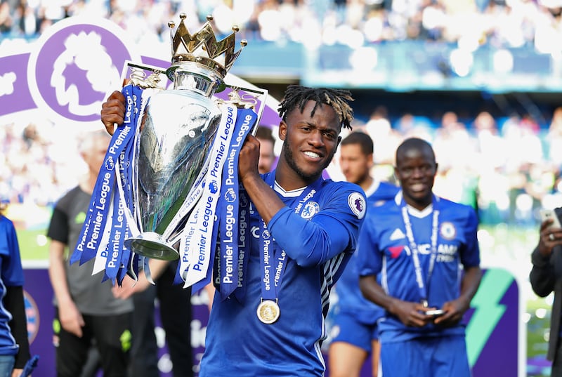 Michy Batshuayi celebrates winning the Premier League title with Chelsea