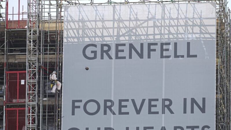 Banners on the outside of Grenfell Tower in west London. Picture by Yui Mok, Press Association 