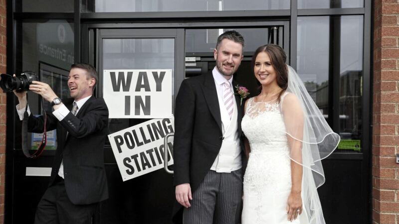 Alliance candidate for West Belfast Sorcha Eastwood casts her vote with her husband, Dale Shirlow, at a polling station in Lisburn Picture Brian Lawless/PA               
